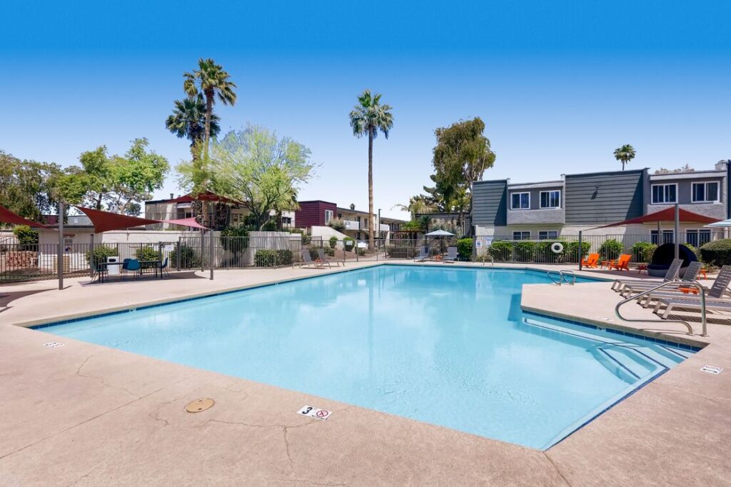 Swimming Pool with deck seating and shade canopy