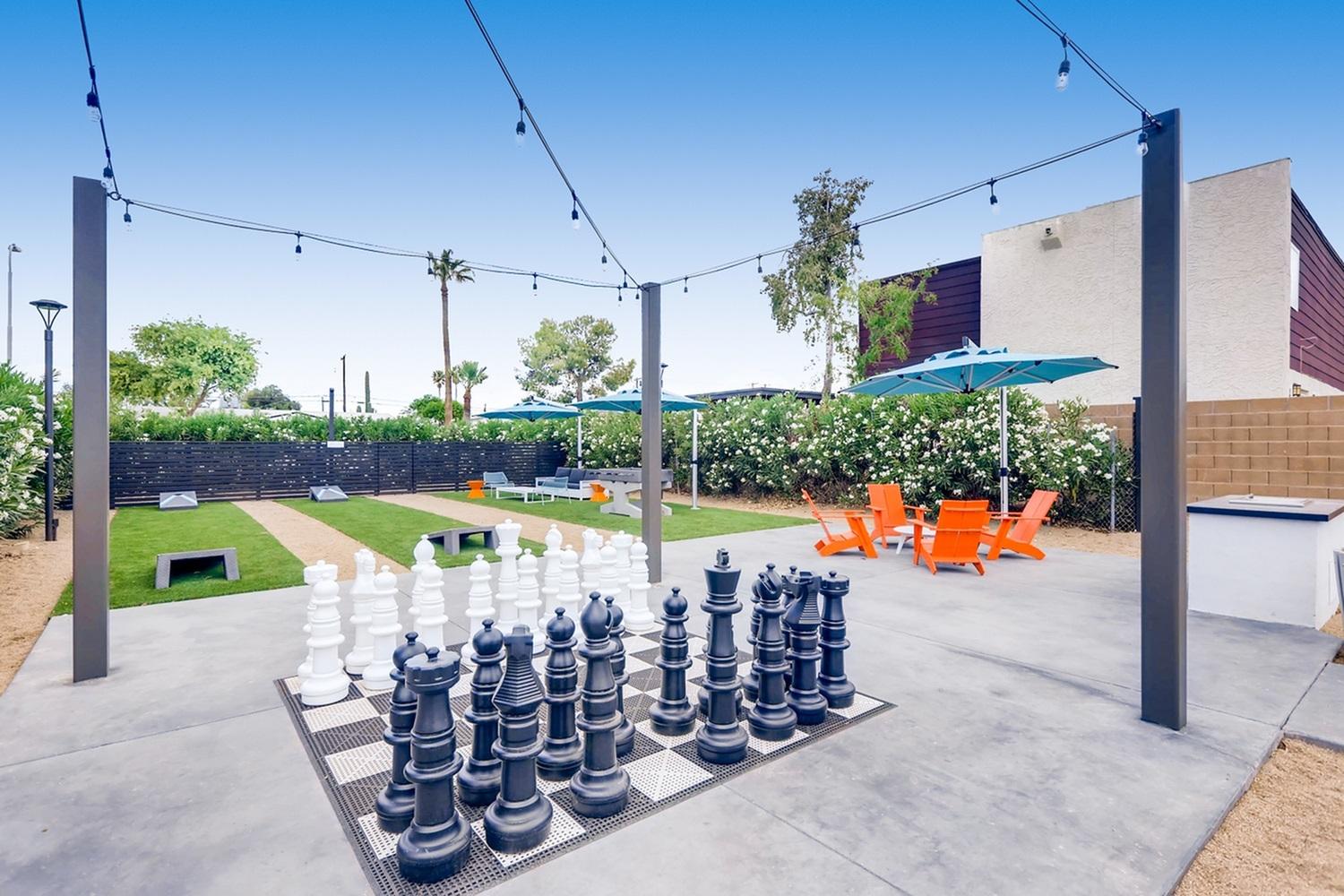 Outdoor game area with chess and seating at Scottsdale Gateway pet-friendly apartments in Tempe